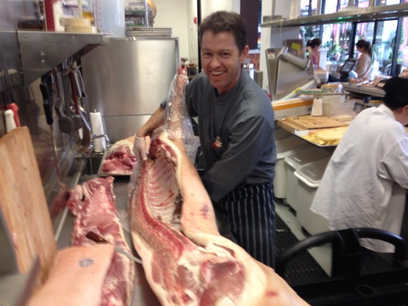 Spotted: Chef Josh Pebbles cutting up a pig at new Borrone MarketBar