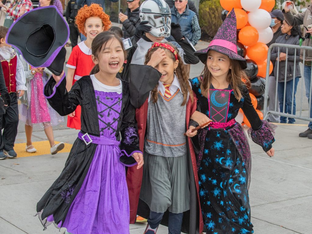 Oak Knoll School Halloween parade filled with smiling faces and fun costumes