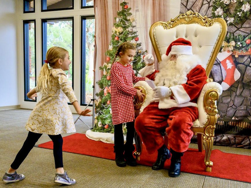 Kids visit with Santa and enjoy crafts this morning in Menlo Park