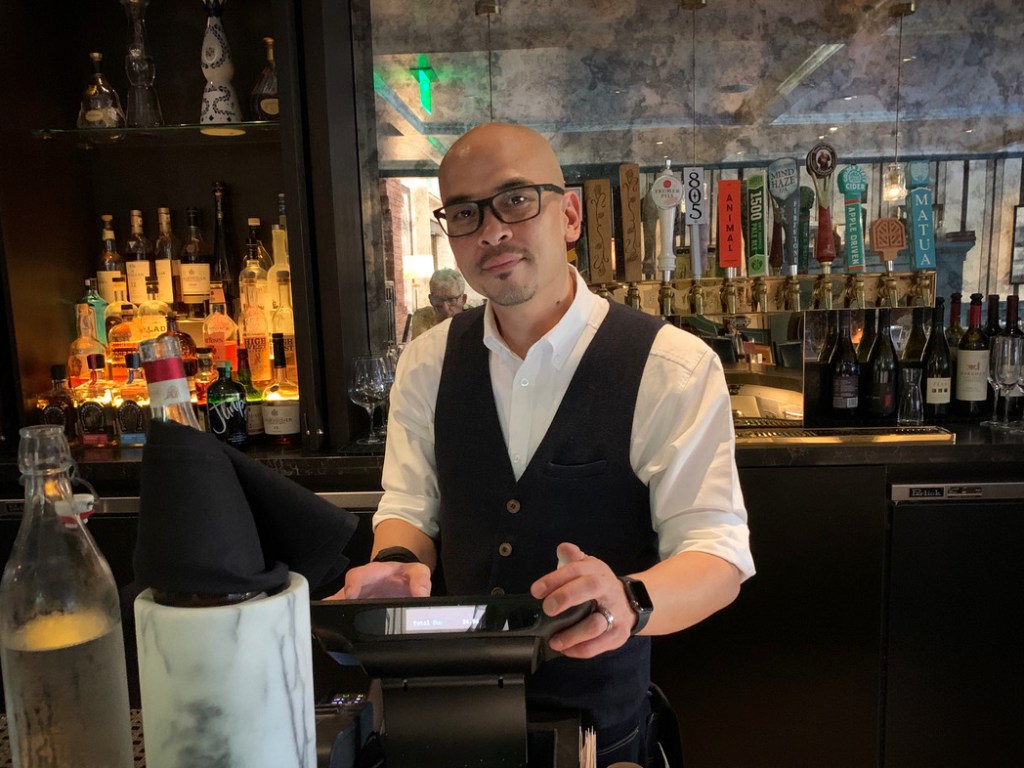 Ron Manlapid brings personality and professionalism to his role as Menlo Tavern bartender
