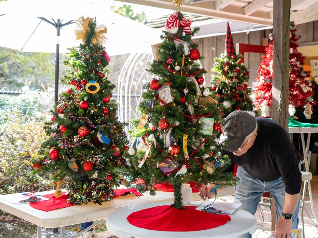 Spotted: Bidding on Christmas tree at Allied Arts Christmas Market
