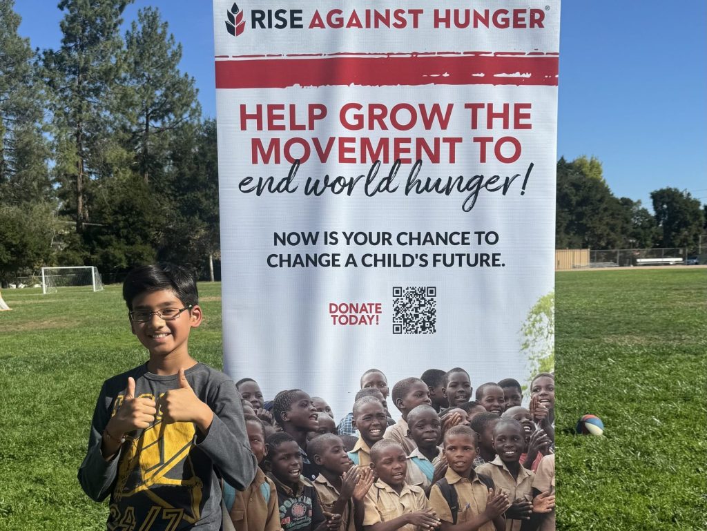 Students in Oak Knoll multiage classroom package meals in Rise Against Hunger project