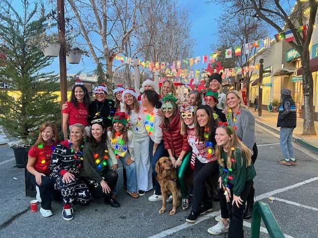 Spotted: Festively dressed women dancing to holiday music