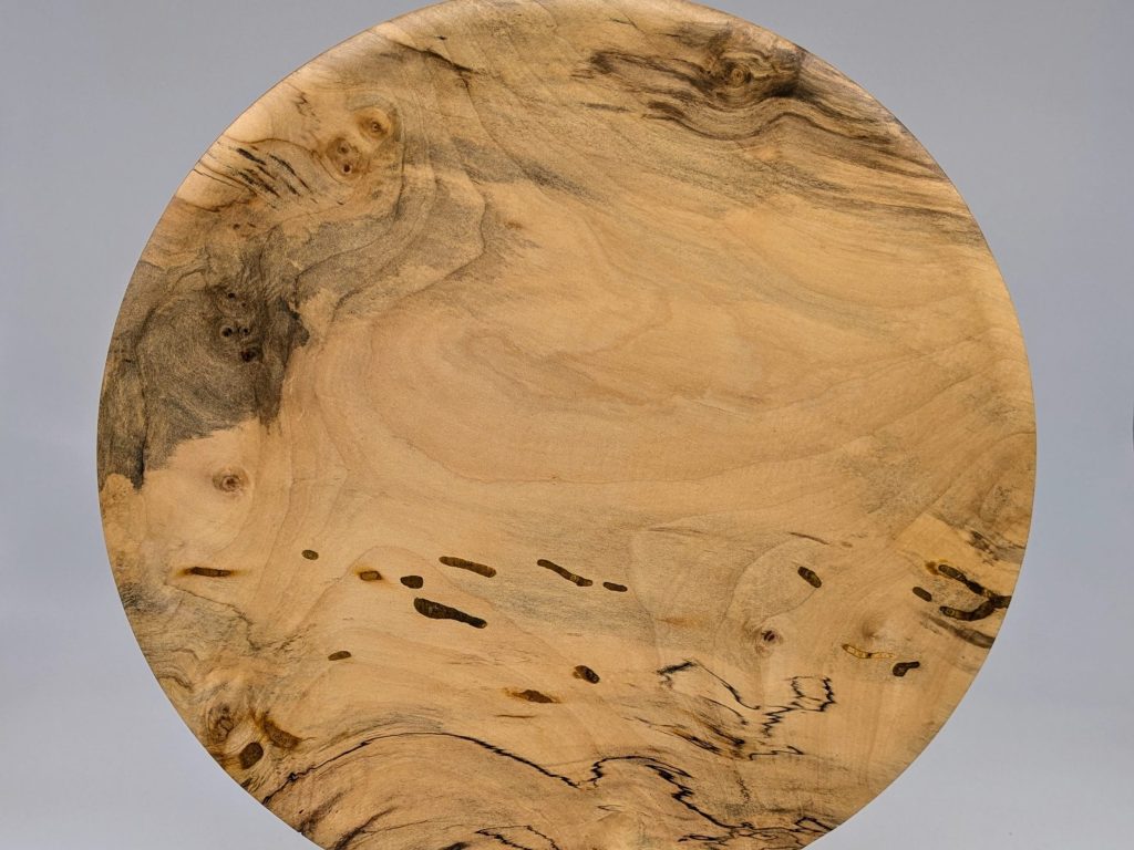 Out of the Wood is featured artist Claude Godcharles exhibit at The Main Gallery