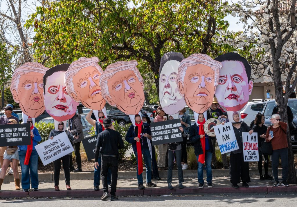 Spotted: Big heads at Hands Off rally