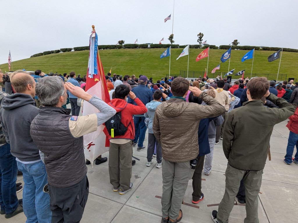 Local Scouts place flags on tombstones at Golden Gate National Cemetery.