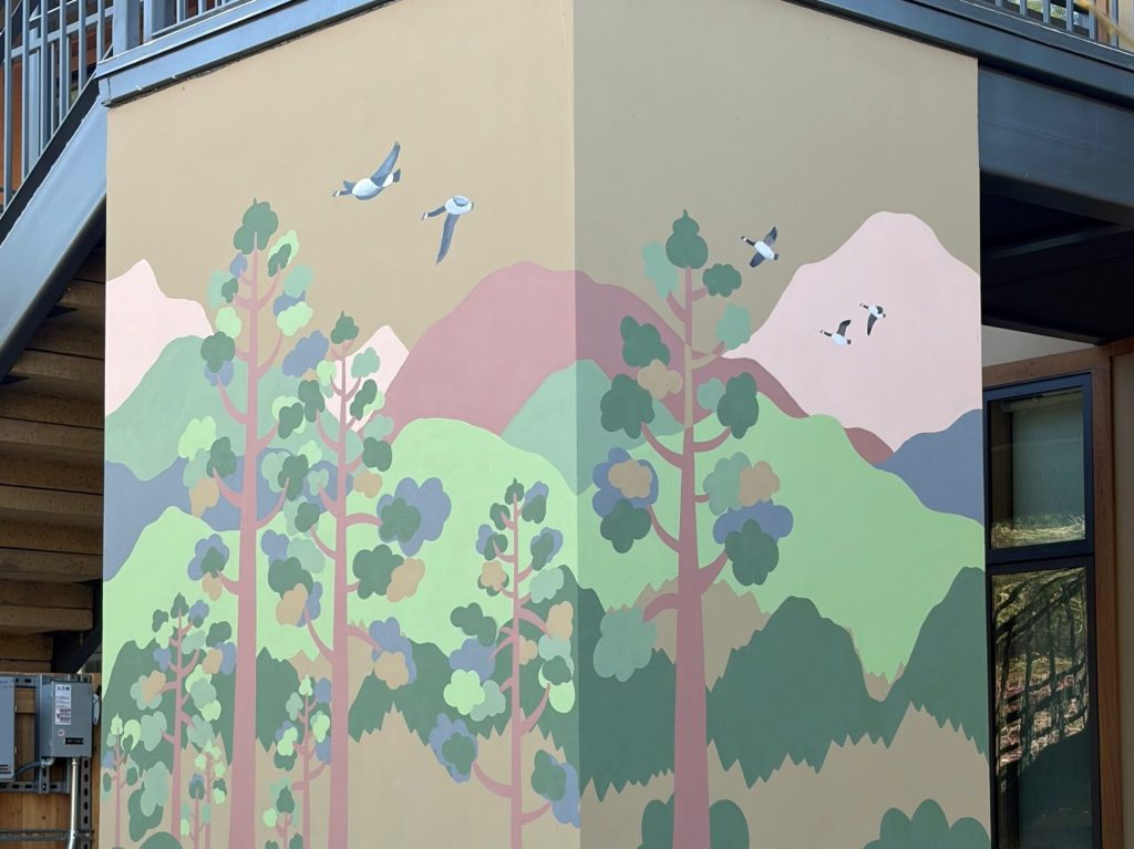 Artist Flo deBretagne works with residents at Willow Commons on three new murals