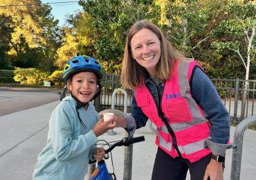 Spotted: Laurel School cyclist greeted by principal with a treat