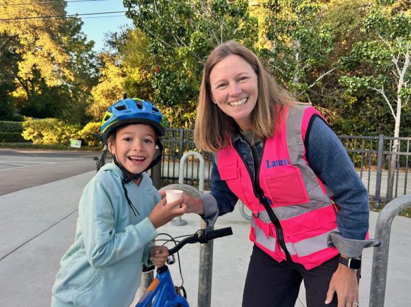Spotted: Laurel School cyclist greeted by principal with a treat