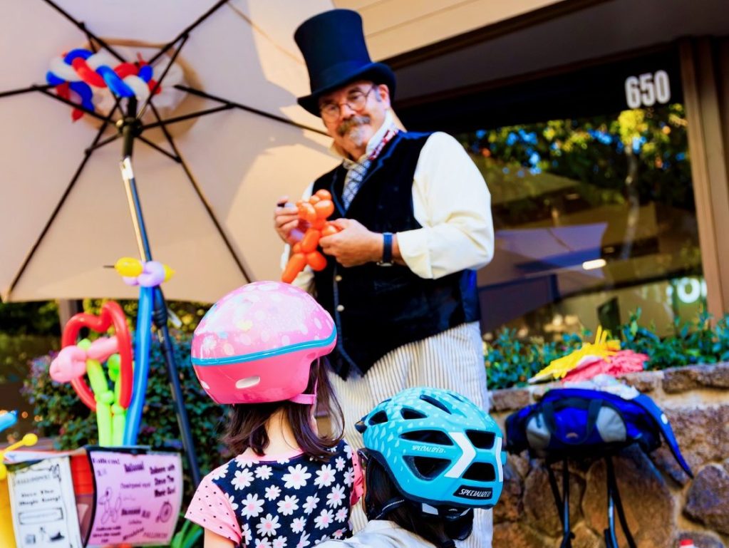 Spotted: Kids having fun with balloon man at Fourth Friday