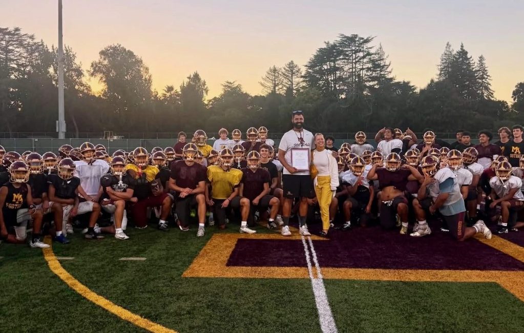 M-A football and Coach Saunders receive recognition for serving community