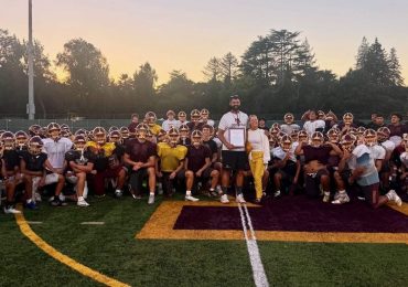 M-A football and Coach Saunders receive recognition for serving community