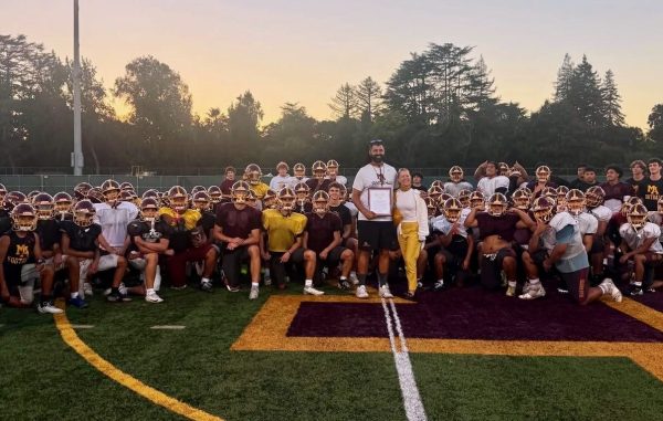 M-A football and Coach Saunders receive recognition for serving community